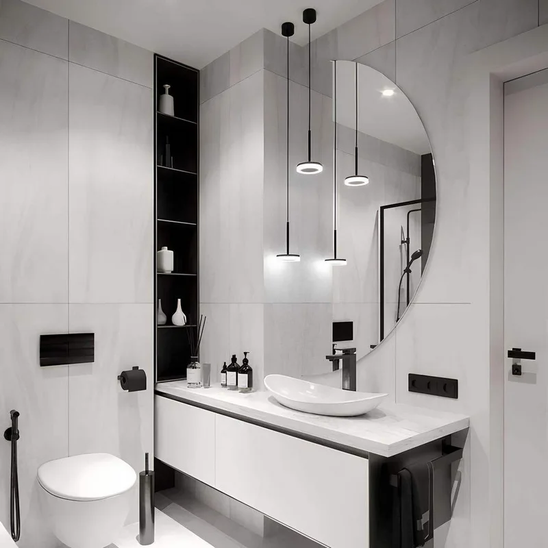 Elegance Luxury Half Moon Glow mirror without backlight, mounted on a white marble wall above a white floating vanity and sink.