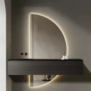 Elegance Luxury Half Moon Glow mirror featuring a vertical backlit semi-circle design behind a dark floating bathroom vanity.
