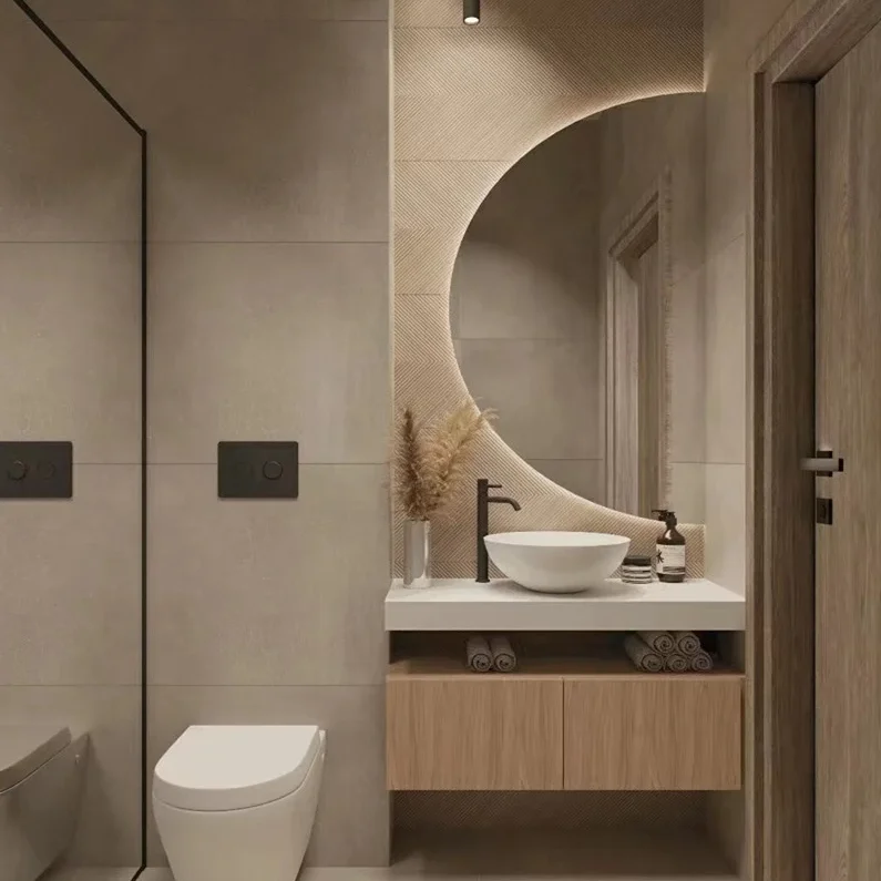 Elegance Luxury Half Moon Glow mirror with warm backlighting, mounted on a textured beige wall above a wooden floating vanity.