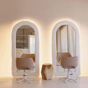 Yoga Arch Full-Length Fitness Mirror arched backlit mirrors in modern studio with chairs soft warm lighting and minimalist decor