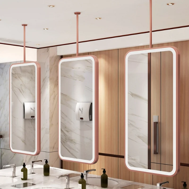 Modern washroom with ceiling-mounted Bathroom Rectangle Hanging LED Mirror above sinks, wood panels and marble wall creating a stylish interior.