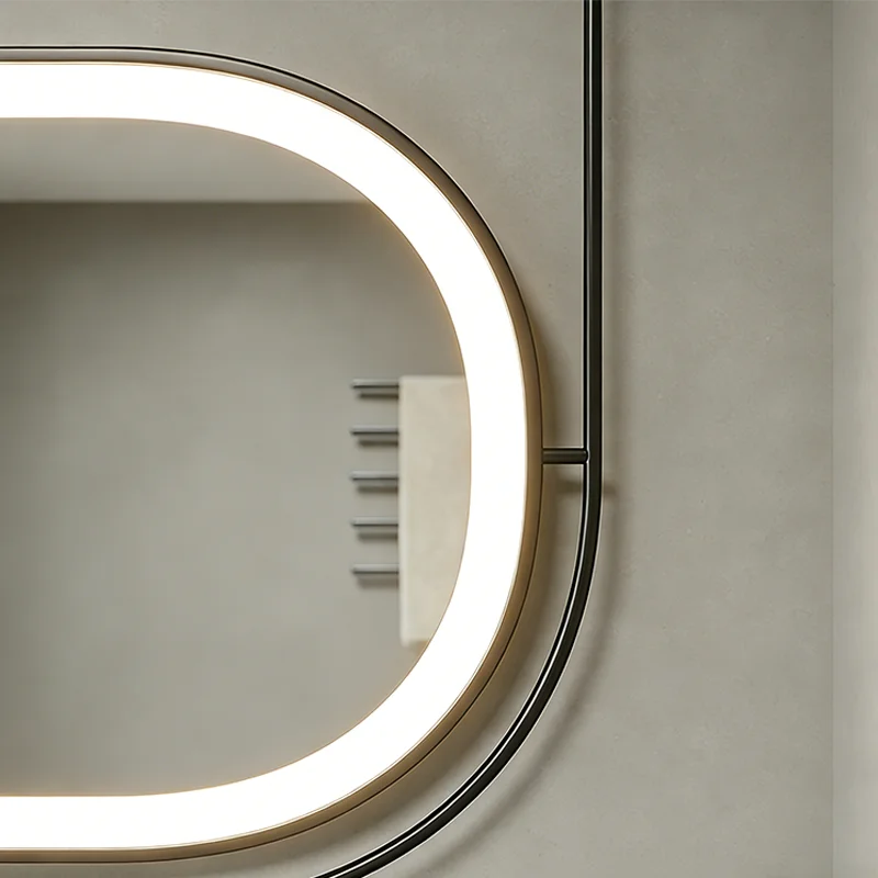 Close-up of a circular LED vanity mirror with a bright ring light mounted on a gray wall, showing its rounded edge and frame.