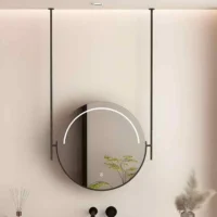Frontlit & Backlit Round Hanging Mirror in a modern bathroom, suspended from ceiling with a soft LED arc illuminating the mirror.