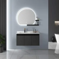 Luxury Half Moon and Shelf mirror with a glowing LED backlight, mounted above a sleek black floating bathroom vanity.