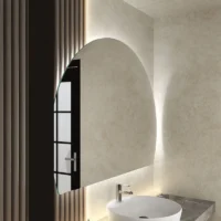 Classic Round LED 4/6 Moon Mirror: A modern half-moon backlit mirror over a white vessel sink in a minimalist bathroom.