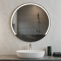 LED Half Moon Round Black Frame Mirror with integrated lighting, mounted on a marble wall above a white vessel sink.