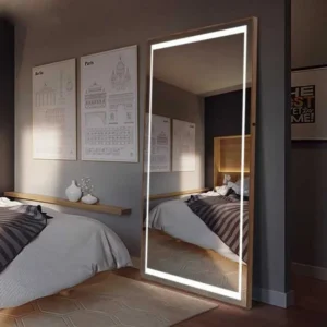 Luxury Bedroom Design LED Full Body Floor Mirror reflecting a modern bed, gray walls, framed art, and warm ambient lighting