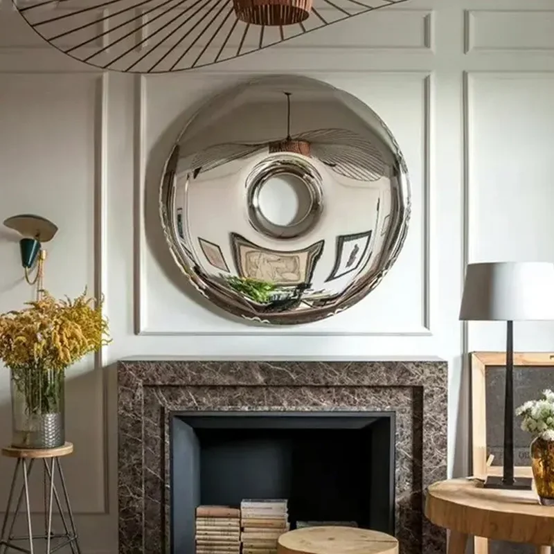 Circle Mirror Above a Minimalist Fireplace