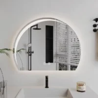 Luxury Half LED Moon Circle Mirror, a modern frameless backlit bathroom mirror with a glowing crescent design over a sink.