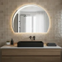 Luxury Half LED Moon Circle Mirror, a glowing crescent-shaped backlit mirror above a marble vanity with gold fixtures.