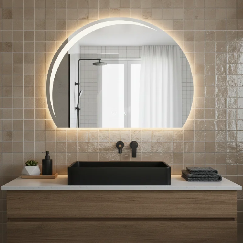 Luxury Half LED Moon Circle Mirror, a glowing crescent-shaped backlit mirror above a marble vanity with gold fixtures.