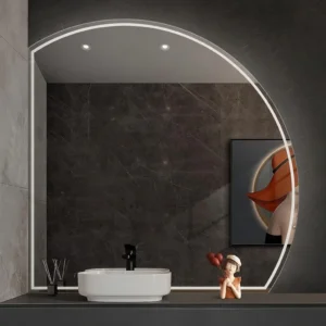 Modern bathroom with a circular backlit mirror, white vessel sink, and dark marble walls; a small statue with red heart balloons sits on the counter beside the faucet.