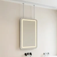 Backlit rectangular mirror mounted on a beige bathroom wall, suspended by two vertical supports.