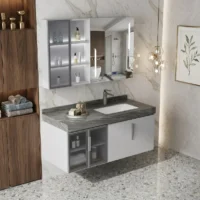 Contemporary bathroom vanity: gray marble countertop, white cabinets, glass-front storage, and a marble wall with a mirror behind the sink.