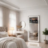 Bright bedroom with a tall backlit full-length mirror, tufted bed, and sheer-curtained window.